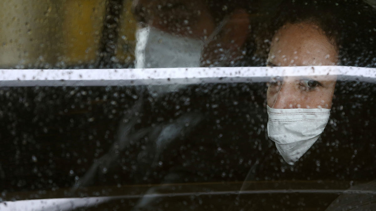 Iranian people wear protective masks to prevent contracting coronavirus, as they sit in taxi in Tehran, Iran on 25 February 2020. Photo: Reuters