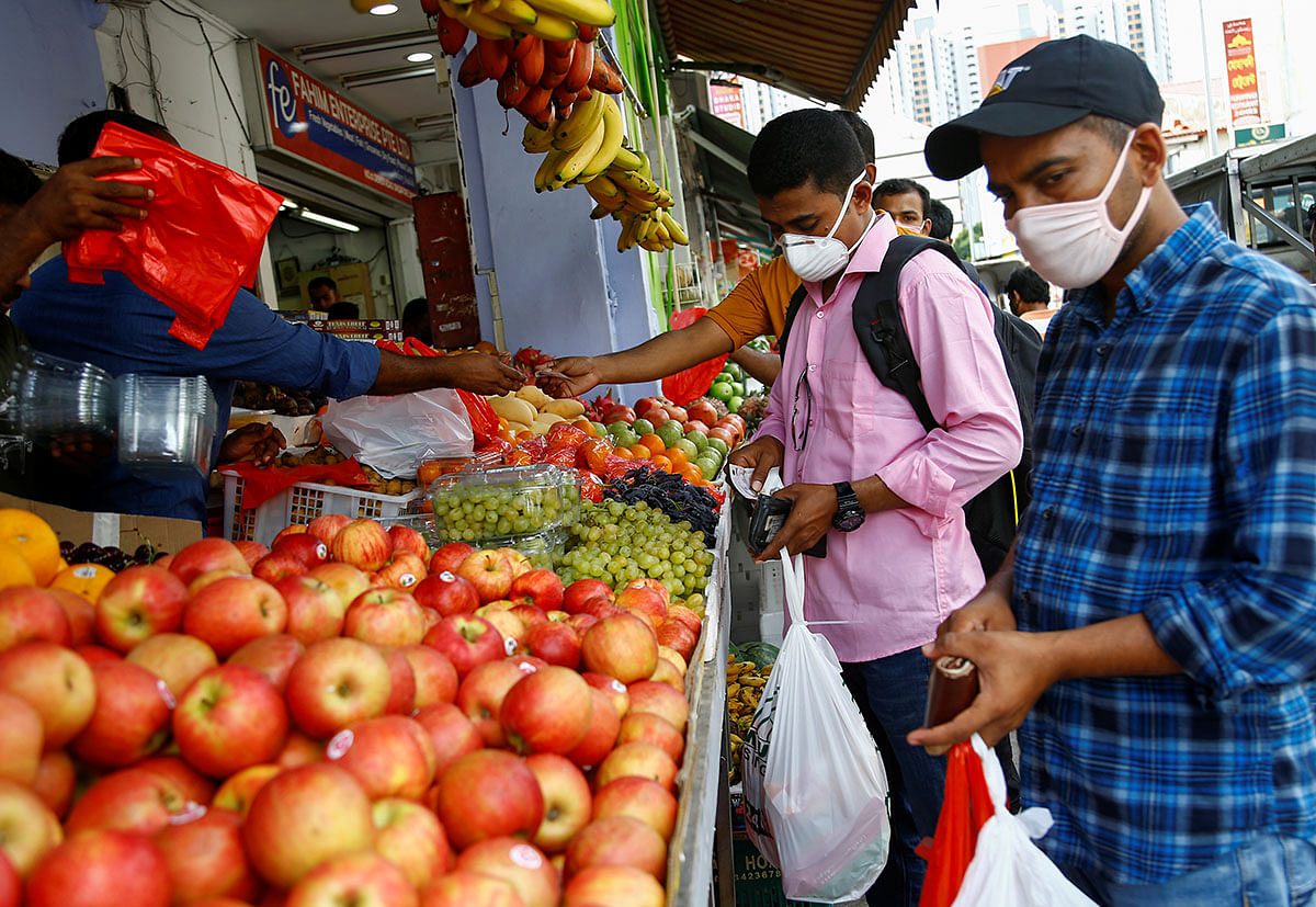 Migrant workers mostly from Bangladesh shop for groceries on their day off in Singapore, 23 February 2020. Photo: Reuters