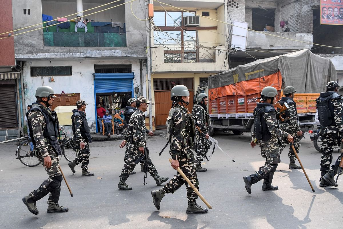 Security personnel patrol on a street following clashes between people supporting and opposing a contentious amendment to India`s citizenship law in New Delhi on 26 February 2020. Photo: AFP