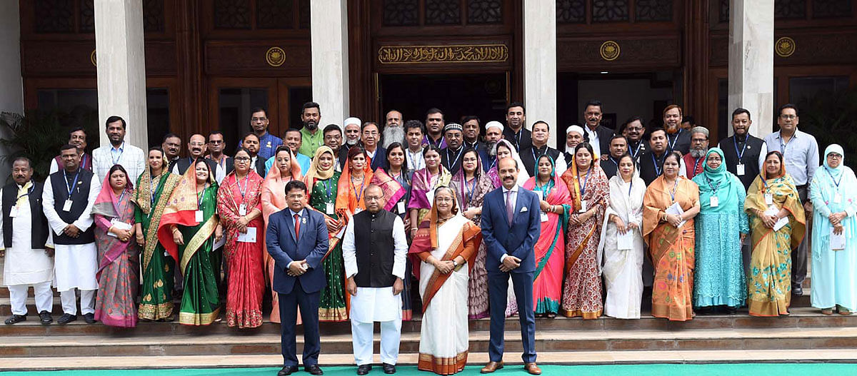 Prime minister Sheikh Hasina takes part in a photo session with DNCC mayor Atiqul Islam and councillors at her office (PMO) in Dhaka on 27 February 2020. Photo: PID