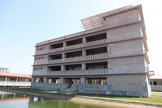 In this handout photo taken on 24 January, 2019 and released on 21 October by Mukta Dinwiddie MacLaren Architects shows buildings intended to accommodate members of the Rohingya refugee community on the silt islet Bhashan Char in the Bay of Bengal. 