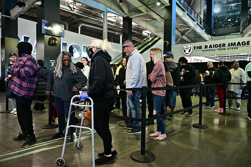 People wait in line to vote at a polling station at Allegiant Stadium in Las Vegas, Nevada, on Election Day, 5 November 2024. 