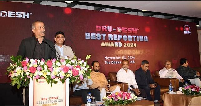 Law, justice and parliamentary affairs adviser Asif Nazrul addresses as the chief guest at the DRU-Desh TV Best Reporting Award-2024 function at Dhaka Club on 8 November 2024