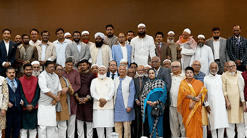 Leaders of political parties pose with interim government chief Dr Muhammad Yunus at the foreign service academy in Dhaka on 4 December 2024.