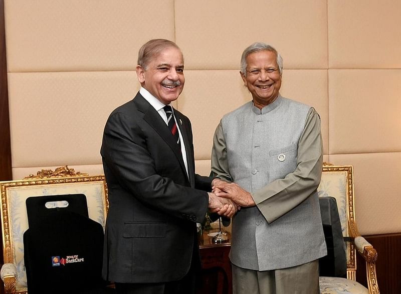 The chief adviser with the Pakistan prime minister during a meeting in Egypt on 19 December, 2024.